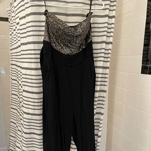 One piece tuxedo style romper with gold sequins